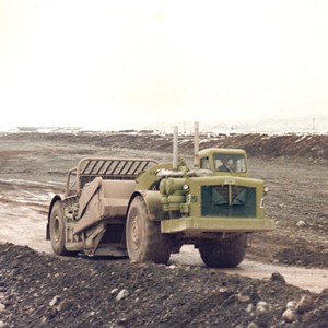 Earthmovers Waikato fleet at speed near Twizel 1974.