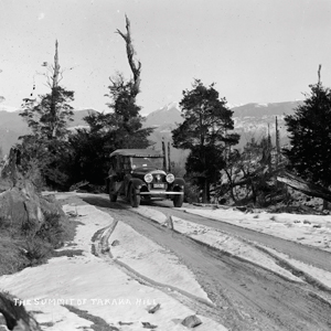 Left: Newman Bros service car driving through snow on the summit of Takaka Hill.