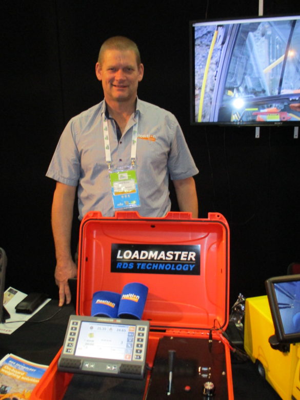 15. Chris Nussey from Position Partners (Australia) next to the latest Loadmaster with its integrated 360 degree camera.