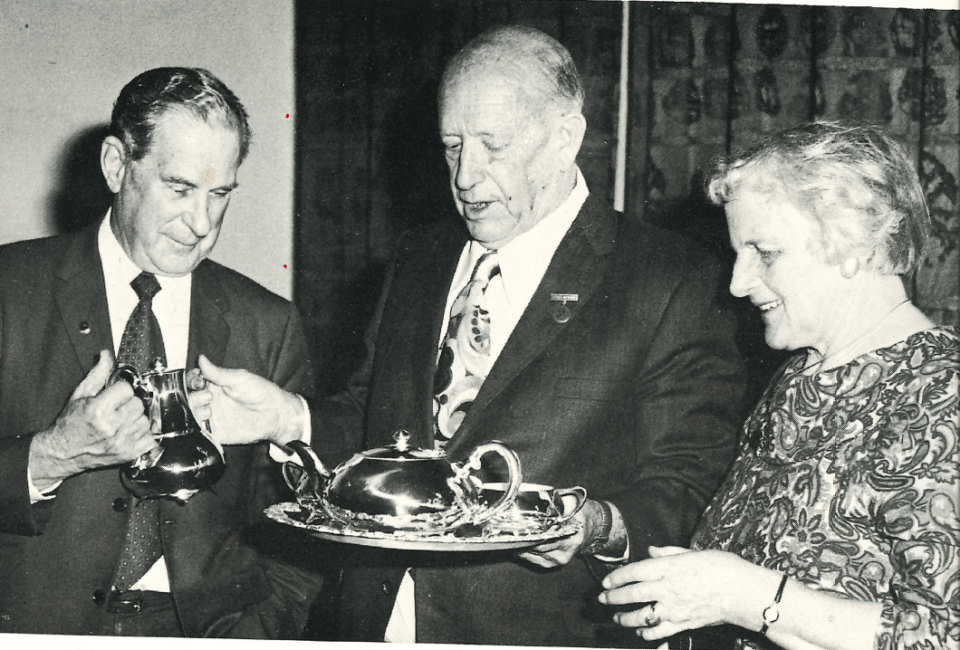 From the archives: On his retirement Ron Tarr and his wife are presented with a silver tea set in 1972 (from the Auckland Branch) from NE (Baldy) Margan, the director of the NZ Contractors Federation. Ron later wrote a history of the federation called – A Strange Breed of Men.